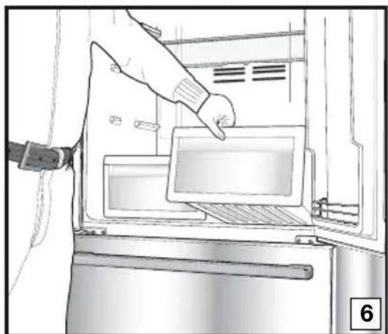 Illustration of a hand inserting a tablet into an oven.