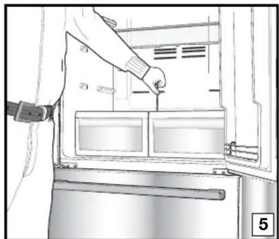 Line drawing of a person inserting a component into a refrigerator.