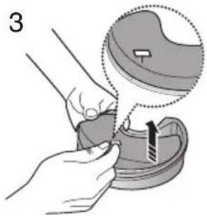 Illustration of a hand holding a small object with a magnified inset showing a component (no text or symbols)