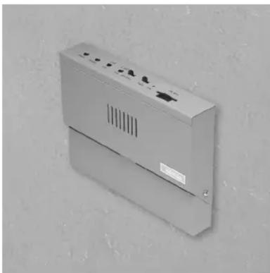 Exterior view of a wall-mounted electrical enclosure with ventilation slots and a label (no readable text or symbols)
