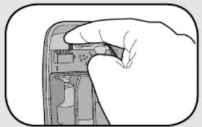 Hand holding a device with a close-up of its screen (no visible text or symbols)