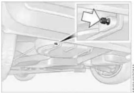 Mechanical assembly diagram showing a car's wheel and suspension components with an inset highlighting a specific part (no text or symbols present)