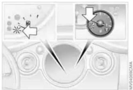 Diagram showing a car interior with directional arrows and a target symbol, no readable text or labels present.