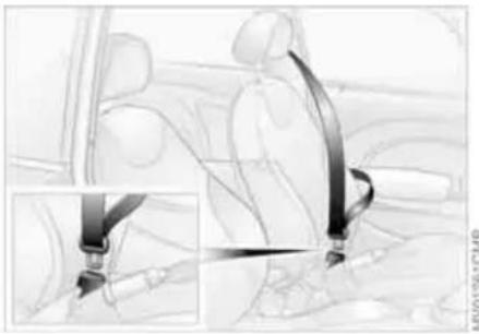 Interior view of a car showing seatbelt and steering wheel (no text or symbols visible)