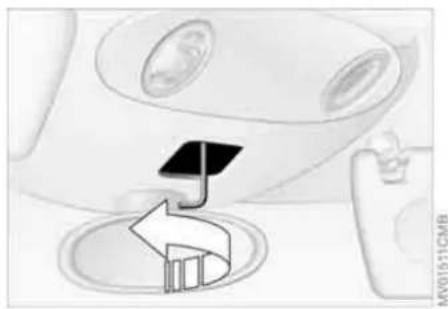 Diagram showing a car interior with a directional arrow and a battery symbol (no text or labels)