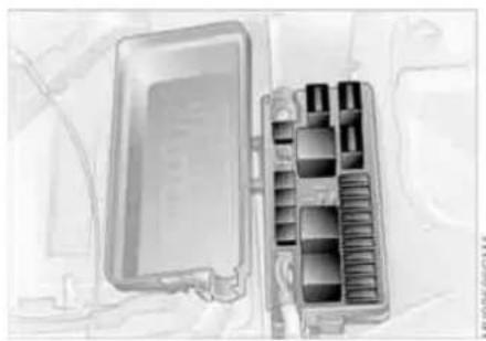 Interior view of a vehicle battery pack with internal compartments (no visible text or symbols)