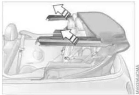 Diagram of a car backrest with two arrows indicating seatbelt insertion (no text or symbols present)