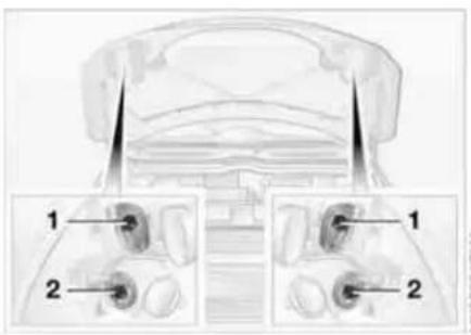 Technical diagram of a car interior with labeled parts, showing front and side views with numbered annotations.