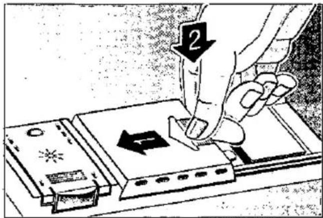 Diagram showing a hand using a tool to press or install a device, with labeled parts and directional arrows indicating process flow.