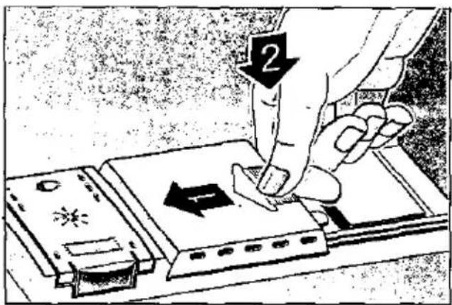 Diagram showing a hand using a tool to press or install electronic components, with labeled arrows and symbols indicating process steps.