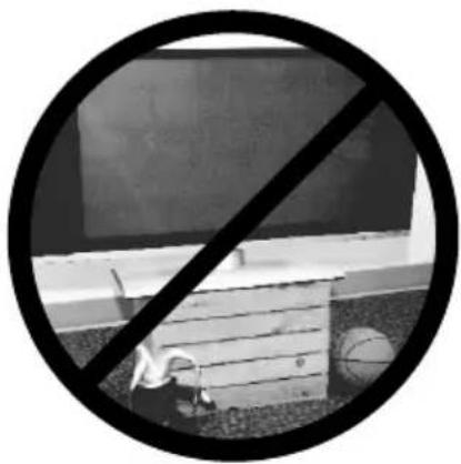 Black and white circular sign with a diagonal line crossing over a building, no text or symbols present.