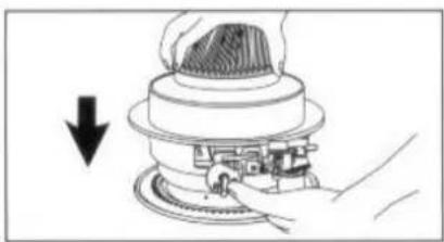 Illustration of hands operating a portable stove burner with a flame on top (no text or symbols)