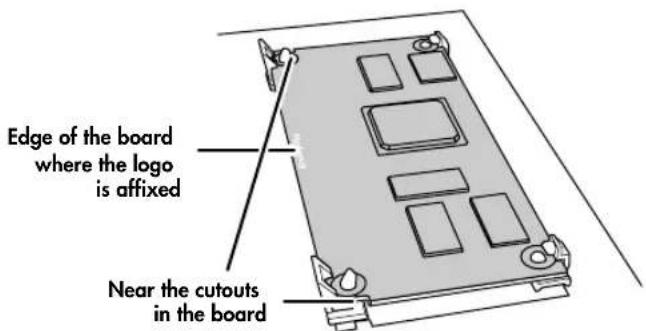 Edge of the board where the logo is affixed Near the cutouts in the board