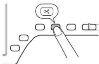 Diagram showing a finger pressing a button labeled 'X' on a surface with other vehicle parts nearby