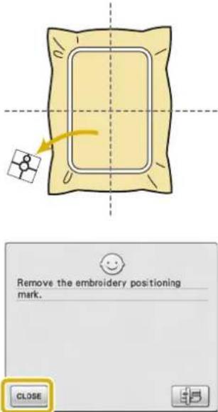 Remove the embroidery positioning mark. CLOSE
