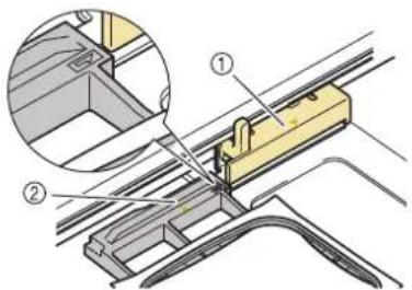 Technical diagram showing a mechanical assembly with labeled components, including a magnified inset of a component detail.