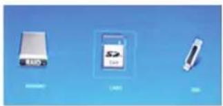 Three electronic devices on a blue background: two white USB drives and one black rectangular device (no visible text or symbols)
