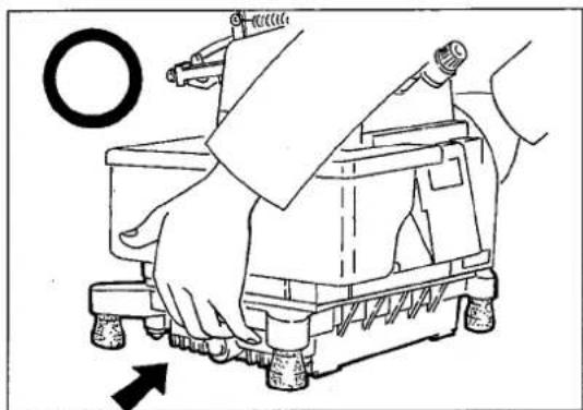 Illustration of a hand operating a small mechanical device with a circular inset showing a ring (no text or symbols)