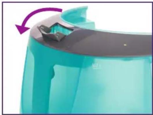 Close-up of a teal-colored plastic container with a purple arrow indicating rotation (no text or symbols)