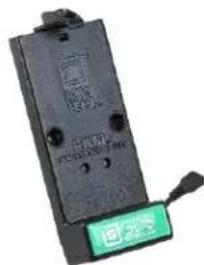 Electronic component with visible label and green button, likely a terminal or terminal block