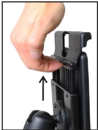 Close-up of a hand adjusting a black mechanical component with an arrow indicating upward motion (no text or symbols visible)