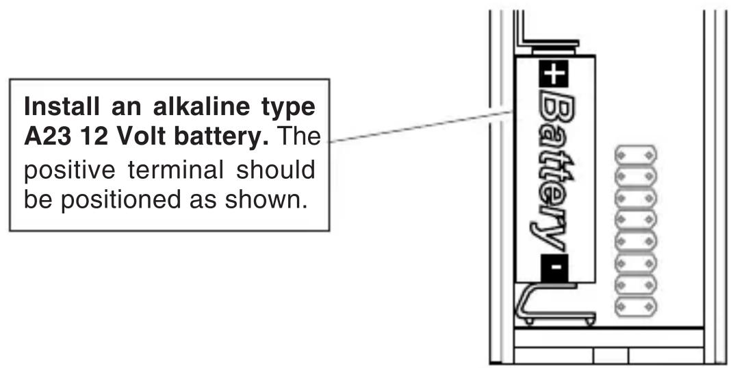 Install an alkaline type A23 12 Volt battery. The positive terminal should be positioned as shown.