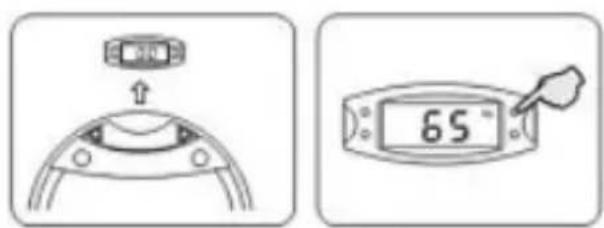 Diagram showing a device with a display and a hand pointer, both labeled with temperature reading of 65 °