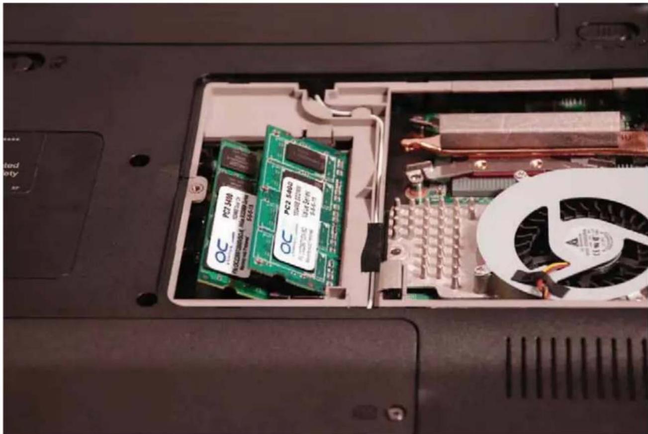 Interior view of a computer drive showing internal components including a green circuit board and fan (no visible text or symbols)