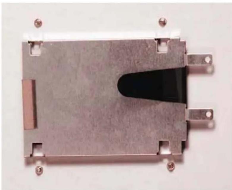 Metallic electronic component with a central black cavity and mounting holes (no text or symbols visible)