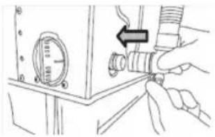 Illustration of a hand adjusting a pipe fitting with a pressure gauge (no text or symbols)