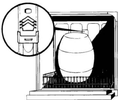 Diagram of a mechanical device inside a chamber, showing internal components and a magnified inset (no text or symbols)