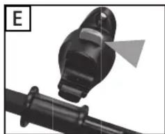 Close-up of a black mechanical component with a pointed tip and arrow, attached to a pipe (no text or symbols visible)