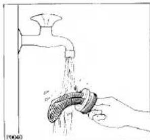Illustration of a hand washing a pipe from a faucet (no text or symbols)