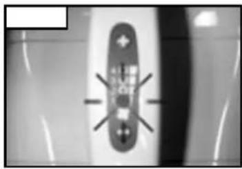 Close-up of a remote control panel with indicator lights (no visible text or symbols)