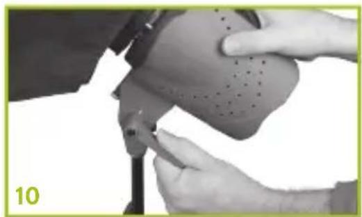 Close-up of hands performing a shoe repair operation with a tool (no visible text or symbols)