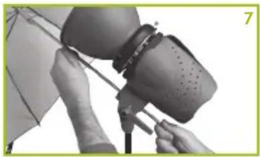 Close-up of hands operating a camera lens assembly (no visible text or symbols)