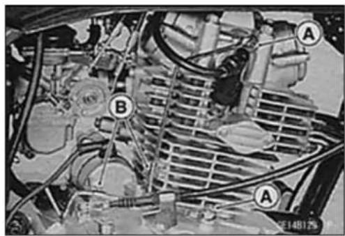 Technical diagram of an automotive engine bay with labeled components A and B, showing internal wiring and structural elements.