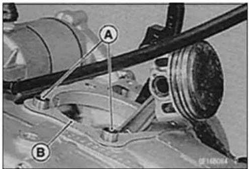 Technical diagram of a mechanical assembly with labeled parts A and B, likely for engine or vehicle maintenance.