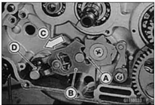 Mechanical gear assembly diagram with labeled components A, B, C, D and a directional arrow indicating motion or movement