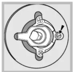 Mechanical component diagram showing a central hub with four arms and a pointer, enclosed in a circular housing (no text or symbols)