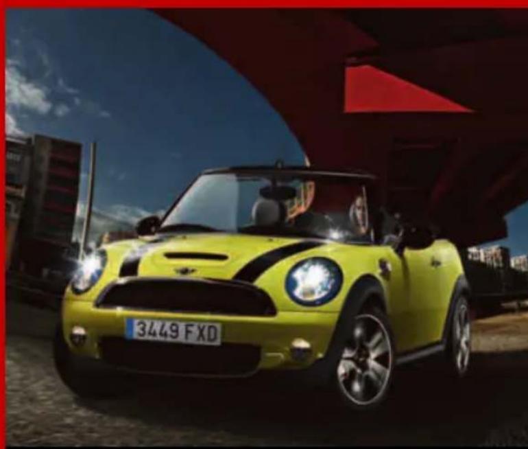 Yellow Mini Cooper car parked under a red abstract structure with blue sky (no visible text or symbols)
