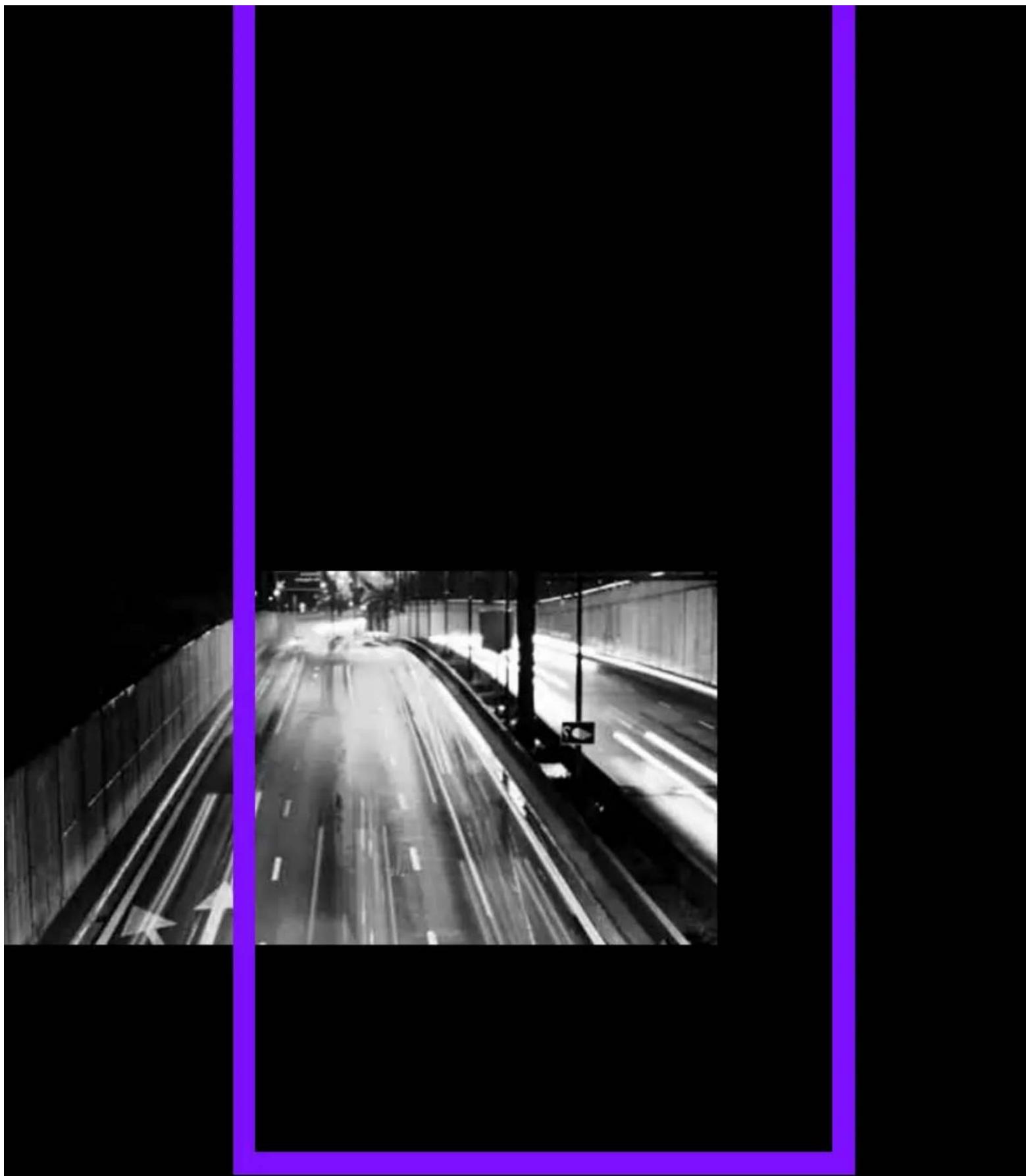Black-and-white night view of a highway with motion blur, framed by a purple border (no visible text or symbols)