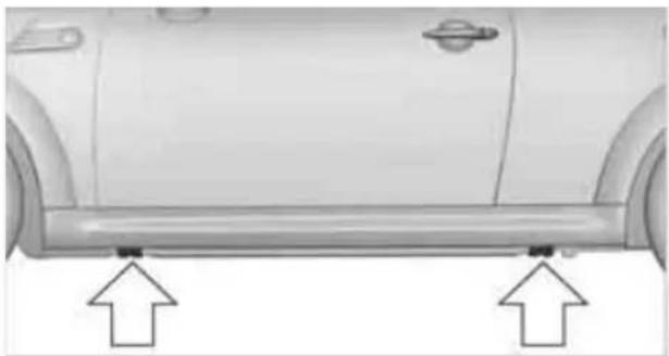 Side view of a car's front bumper with two upward arrows indicating measurement or alignment points (no text or symbols present)