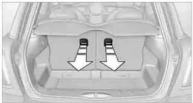 Top-down view of a car interior showing two black-and-white arrows pointing to the side of the seat (no text or symbols present)