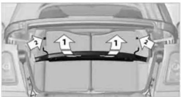 Diagram showing vehicle rearview with directional arrows and numbered labels indicating movement or positioning.