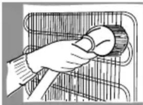 Illustration of a hand holding a tool inside a container (no text or symbols visible)