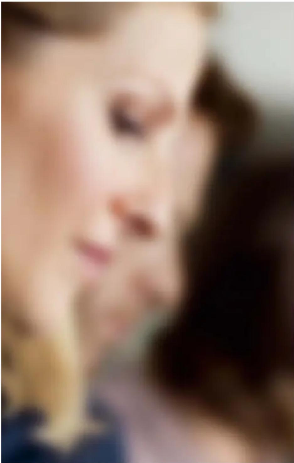 Close-up of a person's face with blurred background (no visible text or symbols)