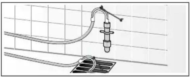 Diagram of a piping system with a valve and socket, mounted on a grid-patterned surface (no text or symbols).