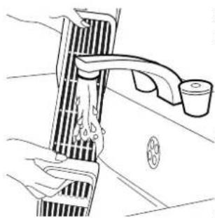 Line drawing of a car interior with exhaust pipes and a water tap (no text or symbols)