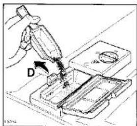 Technical diagram showing a hand using a tool to apply material to a component labeled 'D', with part number 1504 visible.